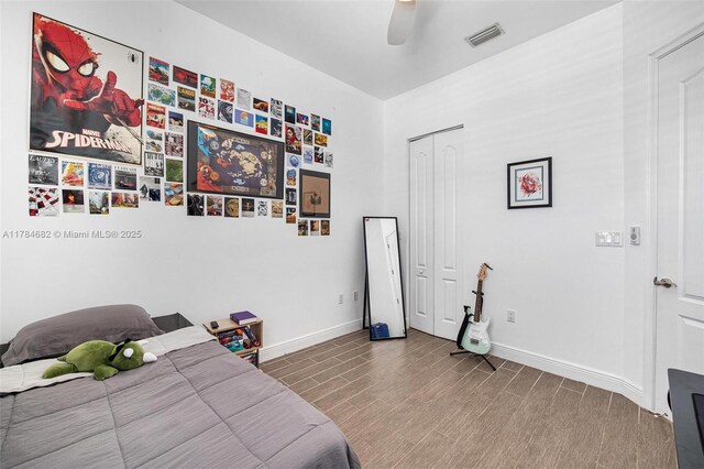 7765 SW 54th Ct Unit 7765, Miami, FL 33143 - bedroom with wood finished floors, a closet, ceiling fan, baseboards, and visible vents