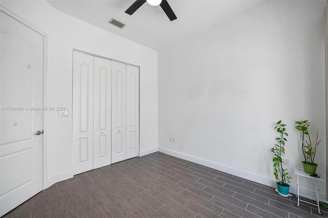 7765 SW 54th Ct Unit 7765, Miami, FL 33143 - unfurnished bedroom featuring baseboards, visible vents, a closet, ceiling fan, and dark wood-type flooring