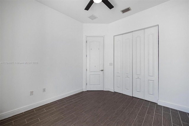 7765 SW 54th Ct Unit 7765, Miami, FL 33143 - unfurnished bedroom with baseboards, dark wood-style flooring, visible vents, and a closet