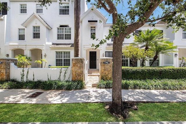 7765 SW 54th Ct Unit 7765, Miami, FL 33143 - townhome / multi-family property featuring stucco siding and a fenced front yard