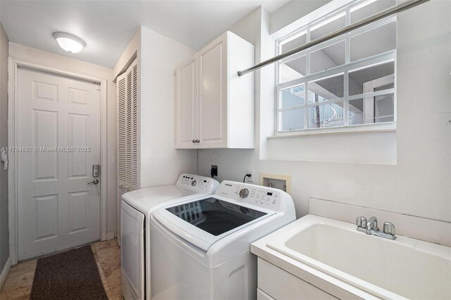 7765 SW 54th Ct Unit 7765, Miami, FL 33143 - washroom with a sink, washer and dryer, and cabinet space