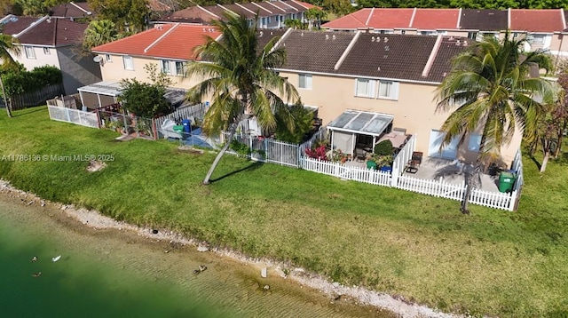 bird's eye view featuring a water view and a residential view