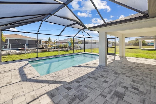 1909 NE 2nd Ave, Cape Coral, FL 33909 - swimming pool featuring a patio area, a yard, and a lanai
