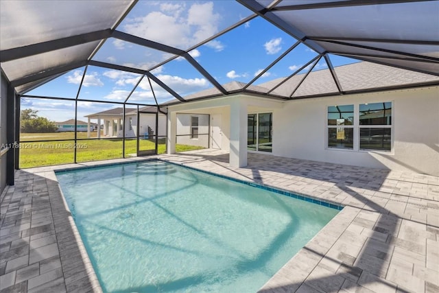 1909 NE 2nd Ave, Cape Coral, FL 33909 - outdoor pool featuring a patio area, a lanai, and a lawn