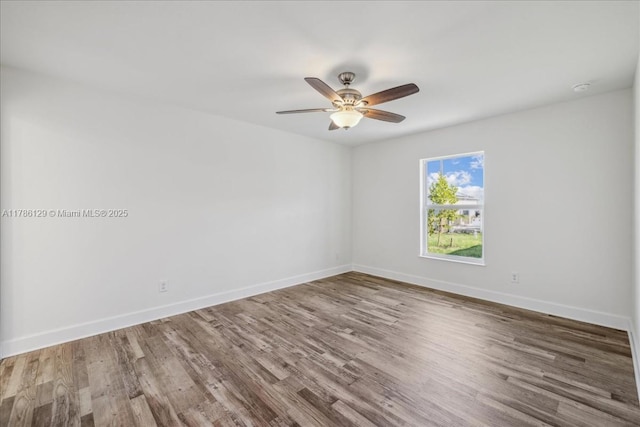 1909 NE 2nd Ave, Cape Coral, FL 33909 - spare room featuring wood finished floors, ceiling fan, and baseboards