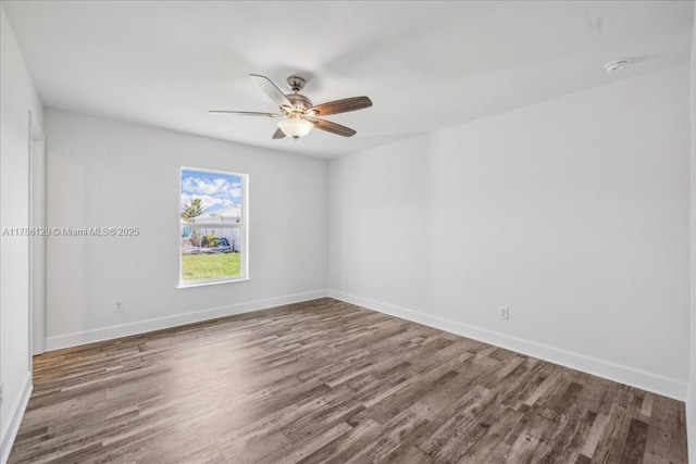 1909 NE 2nd Ave, Cape Coral, FL 33909 - empty room featuring wood finished floors, a ceiling fan, baseboards, and a smoke detector