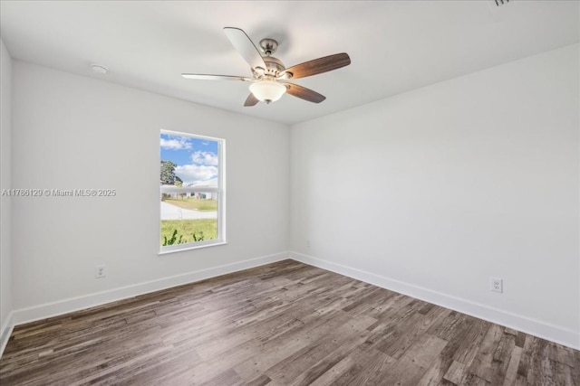 1909 NE 2nd Ave, Cape Coral, FL 33909 - spare room with wood finished floors, baseboards, and a ceiling fan