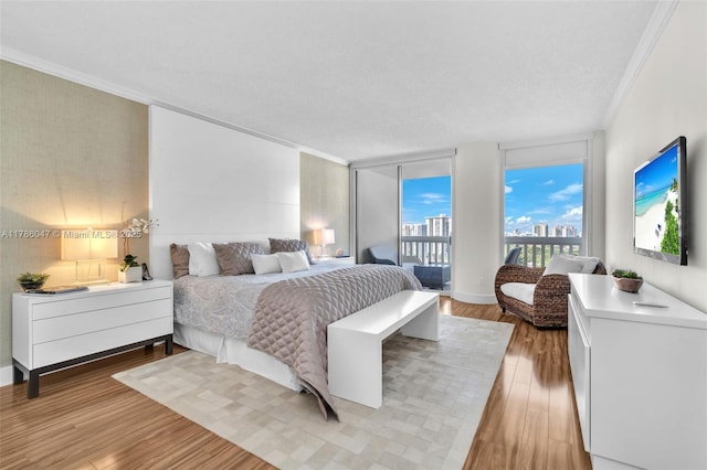 2000 Island Blvd Unit 1704, Aventura, FL 33160 - bedroom featuring light wood finished floors, access to outside, and crown molding