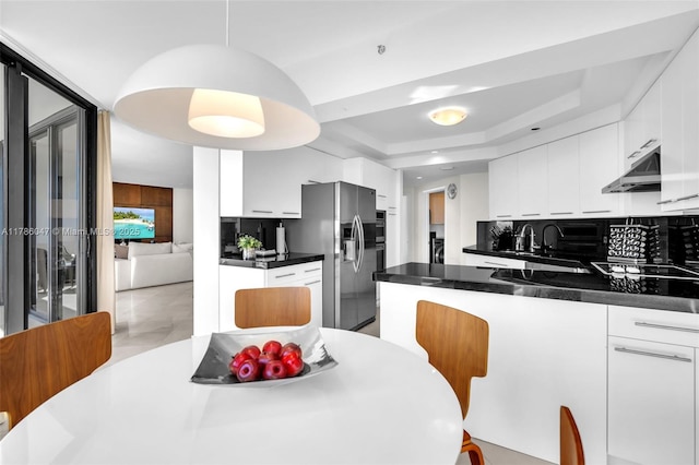 2000 Island Blvd Unit 1704, Aventura, FL 33160 - kitchen featuring under cabinet range hood, stainless steel appliances, and white cabinets
