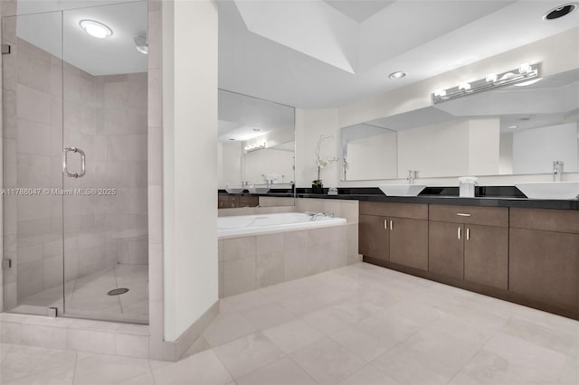 2000 Island Blvd Unit 1704, Aventura, FL 33160 - bathroom featuring recessed lighting, a stall shower, tile patterned floors, double vanity, and a garden tub