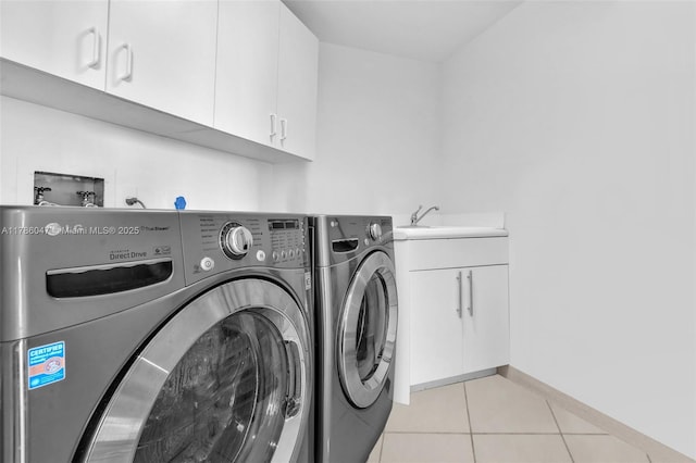 2000 Island Blvd Unit 1704, Aventura, FL 33160 - laundry room featuring light tile patterned floors, baseboards, washer and dryer, a sink, and cabinet space