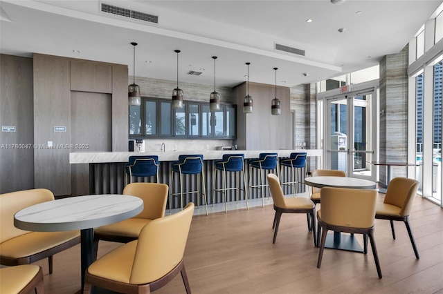 2000 Island Blvd Unit 1704, Aventura, FL 33160 - dining space with visible vents and light wood-style floors