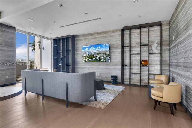 2000 Island Blvd Unit 1704, Aventura, FL 33160 - living area featuring an accent wall, expansive windows, and wood finished floors
