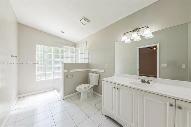 full bath with toilet, baseboards, lofted ceiling, tile patterned flooring, and vanity