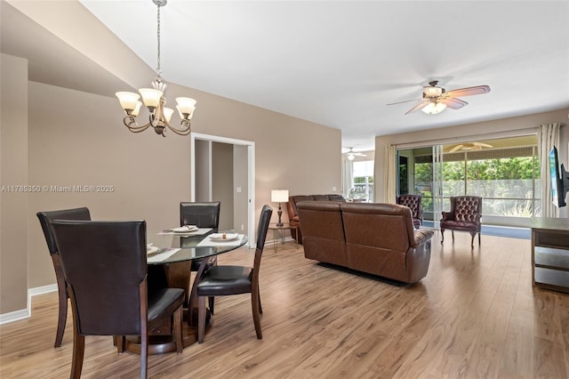 15161 Royal Windsor Ln Unit 2603, Fort Myers, FL 33919 - dining space featuring light wood finished floors, a ceiling fan, a chandelier, and baseboards