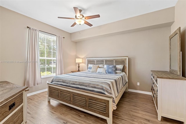 15161 Royal Windsor Ln Unit 2603, Fort Myers, FL 33919 - bedroom with light wood-style flooring, baseboards, and a ceiling fan