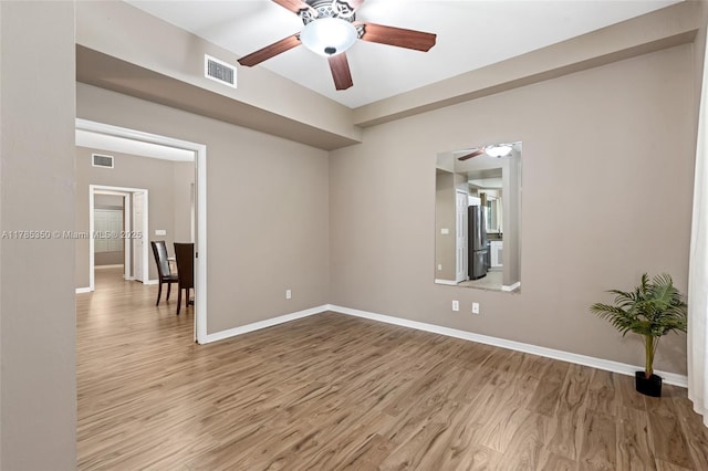15161 Royal Windsor Ln Unit 2603, Fort Myers, FL 33919 - spare room featuring a ceiling fan, wood finished floors, and baseboards