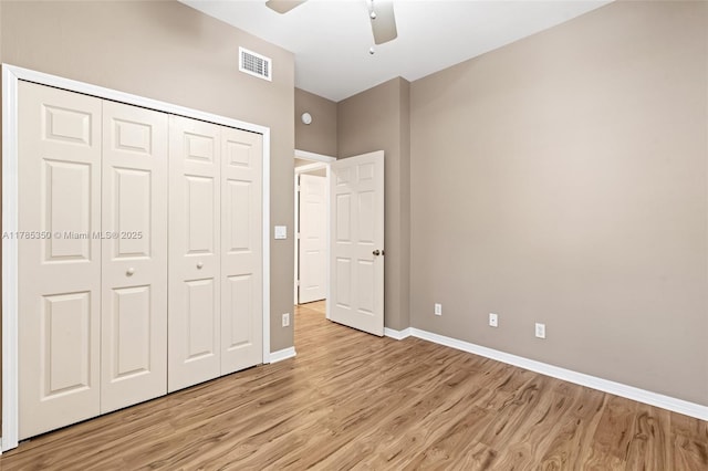15161 Royal Windsor Ln Unit 2603, Fort Myers, FL 33919 - unfurnished bedroom featuring light wood finished floors, baseboards, a closet, and a ceiling fan