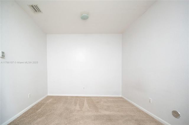 445 NE 21st Ave, Homestead, FL 33033 - spare room featuring light colored carpet and baseboards