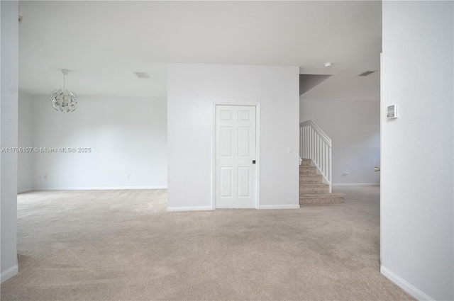 445 NE 21st Ave, Homestead, FL 33033 - carpeted spare room with stairway and a chandelier