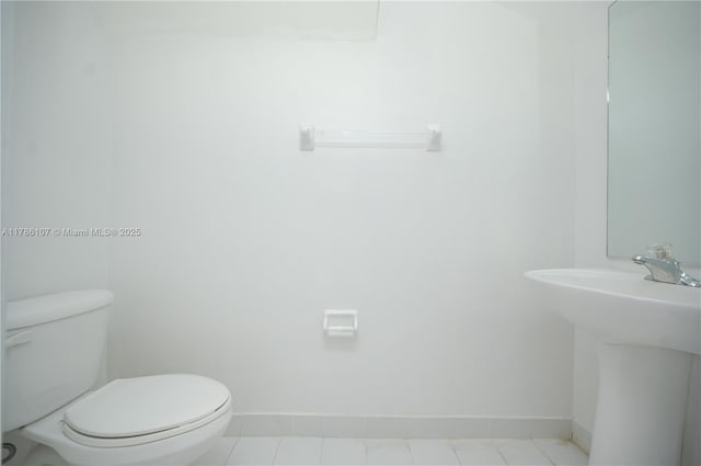 445 NE 21st Ave, Homestead, FL 33033 - half bathroom with toilet and tile patterned flooring