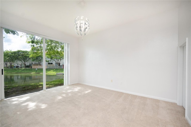 445 NE 21st Ave, Homestead, FL 33033 - spare room featuring a chandelier and light colored carpet