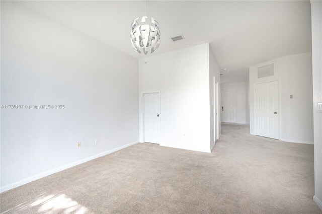 445 NE 21st Ave, Homestead, FL 33033 - spare room featuring light carpet