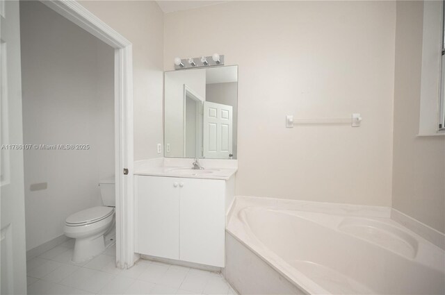 445 NE 21st Ave, Homestead, FL 33033 - bathroom featuring a garden tub, vanity, and tile patterned flooring