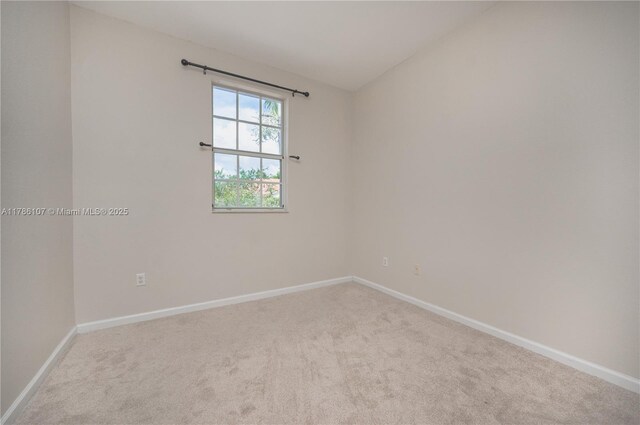 445 NE 21st Ave, Homestead, FL 33033 - empty room with carpet and lofted ceiling