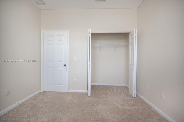 445 NE 21st Ave, Homestead, FL 33033 - unfurnished bedroom with carpet floors and a closet