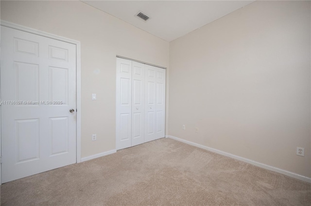 445 NE 21st Ave, Homestead, FL 33033 - unfurnished bedroom with carpet floors and a closet