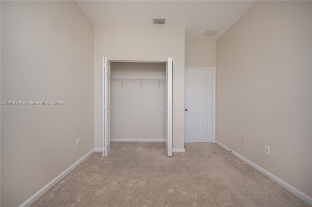 445 NE 21st Ave, Homestead, FL 33033 - unfurnished bedroom with carpet flooring and a closet