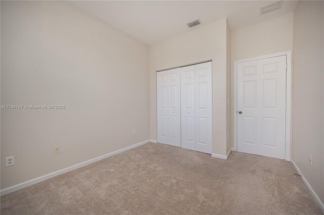 445 NE 21st Ave, Homestead, FL 33033 - unfurnished bedroom featuring carpet flooring and a closet
