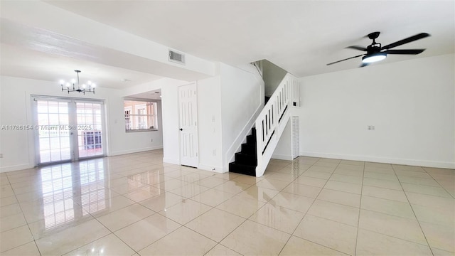 interior space featuring light tile patterned flooring, baseboards, visible vents, and stairs