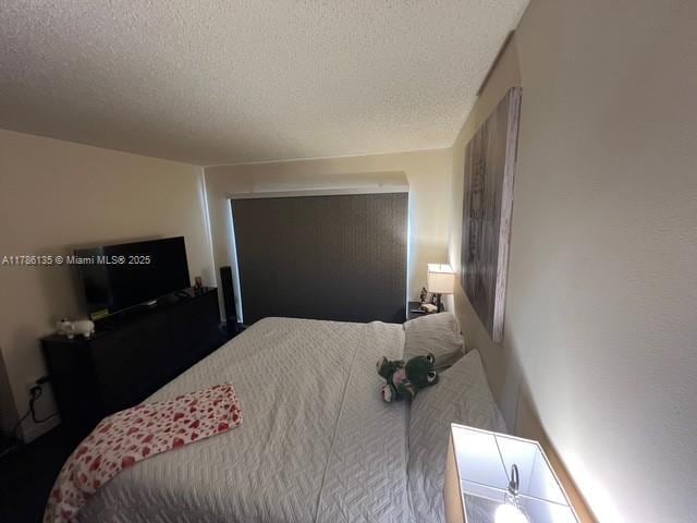 bedroom featuring a textured ceiling