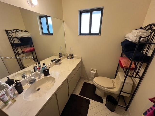 bathroom with toilet and vanity