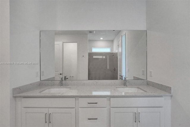 full bathroom featuring double vanity, visible vents, a sink, and a stall shower
