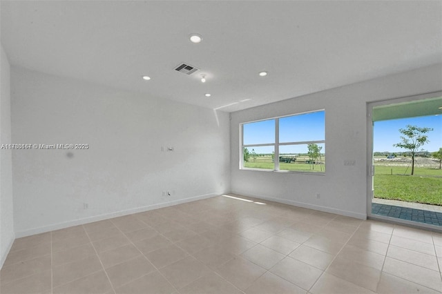 unfurnished room featuring light tile patterned floors, baseboards, recessed lighting, and visible vents