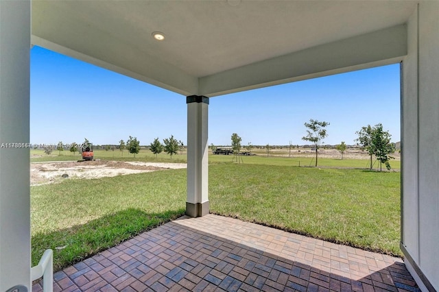 view of patio / terrace with a rural view