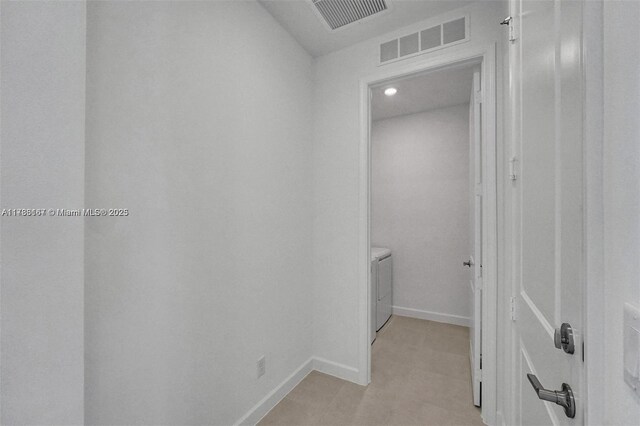 corridor featuring baseboards, recessed lighting, washer / clothes dryer, and visible vents