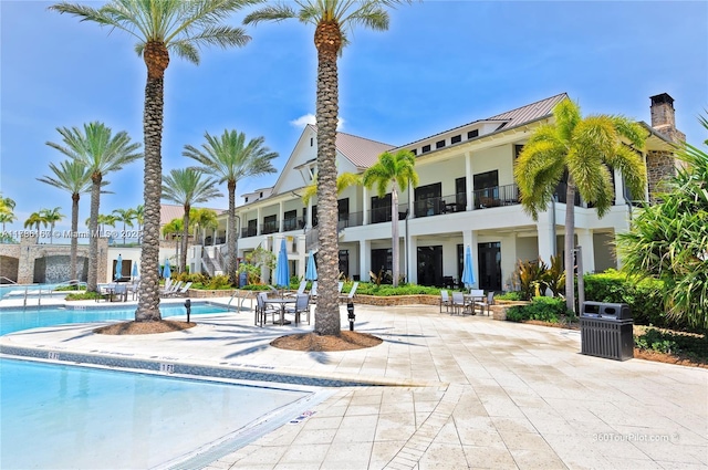community pool featuring a patio area