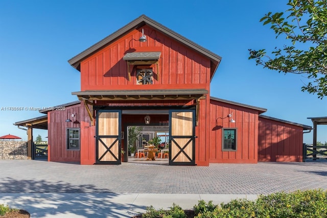 view of barn with an exterior structure