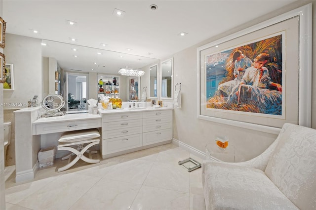 bathroom featuring toilet, tile patterned floors, baseboards, vanity, and recessed lighting
