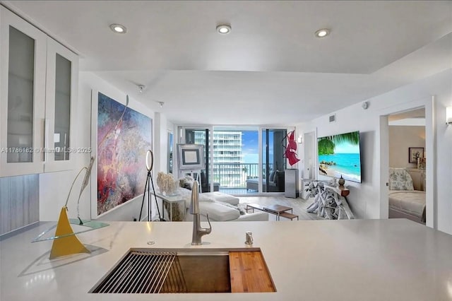 2200 NE 33rd Ave Unit 10F, Fort Lauderdale, FL 33305 - kitchen featuring recessed lighting, expansive windows, visible vents, and open floor plan