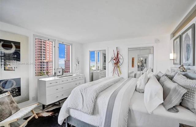 2200 NE 33rd Ave Unit 10F, Fort Lauderdale, FL 33305 - bedroom featuring dark wood-type flooring