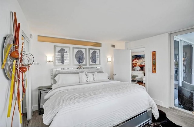 2200 NE 33rd Ave Unit 10F, Fort Lauderdale, FL 33305 - bedroom featuring wood finished floors and visible vents