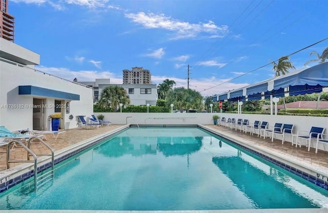 2200 NE 33rd Ave Unit 10F, Fort Lauderdale, FL 33305 - community pool featuring a patio area and fence