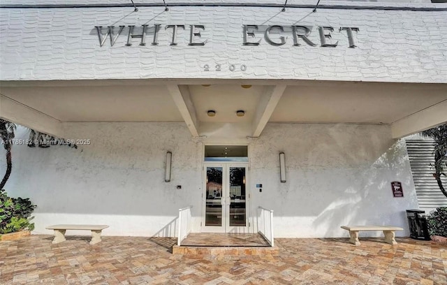 2200 NE 33rd Ave Unit 10F, Fort Lauderdale, FL 33305 - property entrance featuring stucco siding