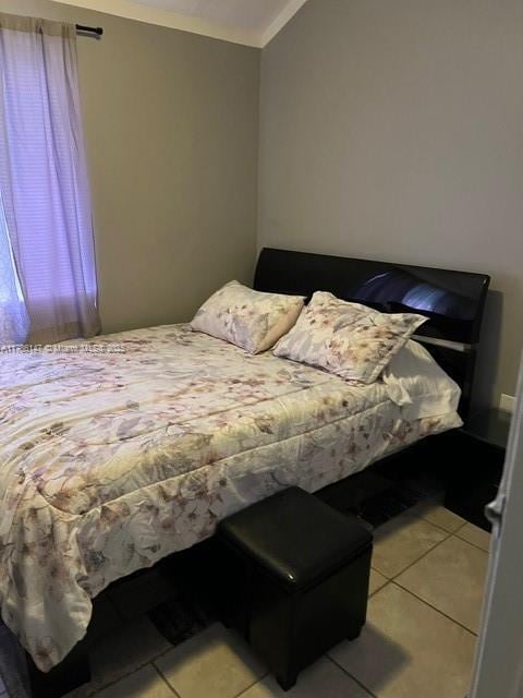 12045 SW 18th St Unit 1-42, Miami, FL 33175 - bedroom featuring light tile patterned flooring and vaulted ceiling