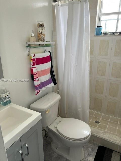 12045 SW 18th St Unit 1-42, Miami, FL 33175 - full bathroom featuring vanity and a tile shower